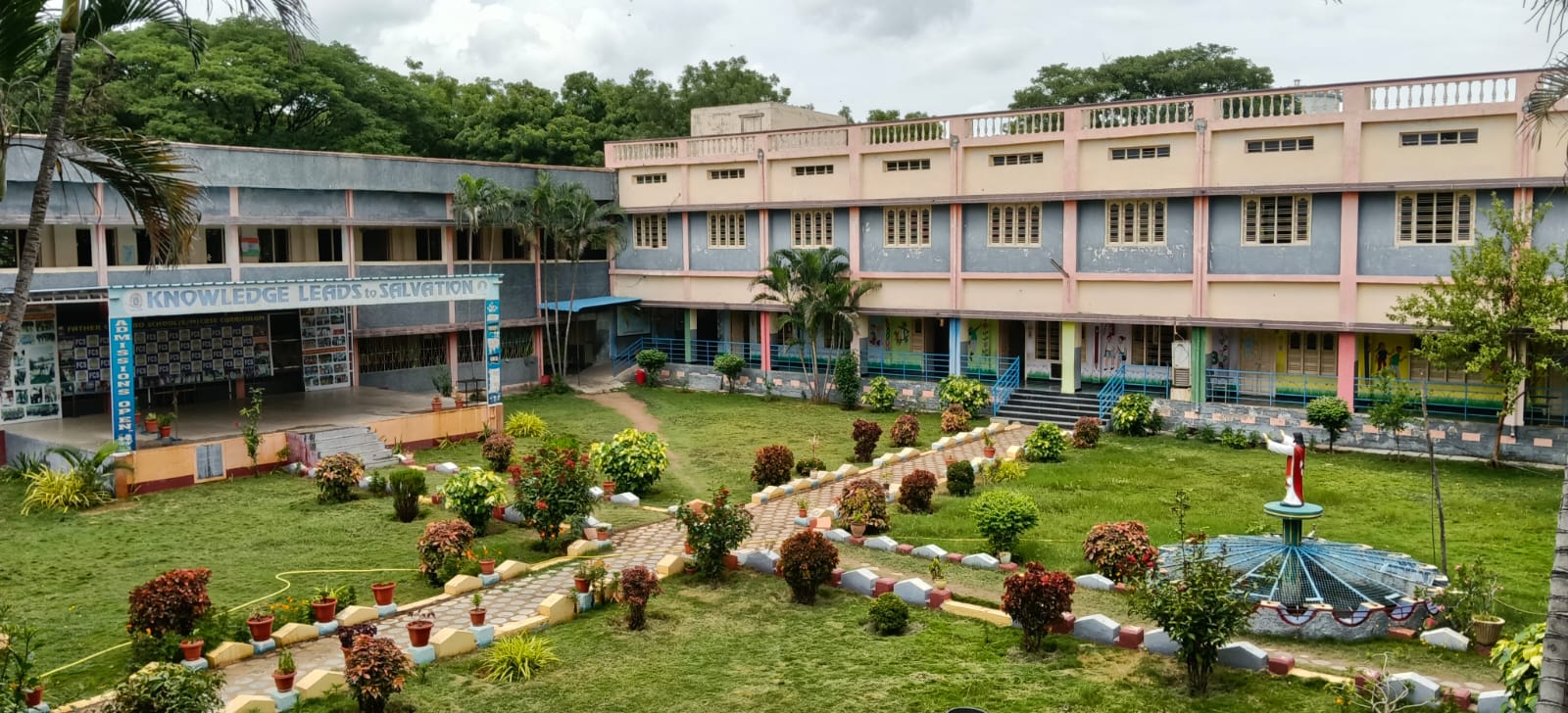 Father Colombo School building and garden